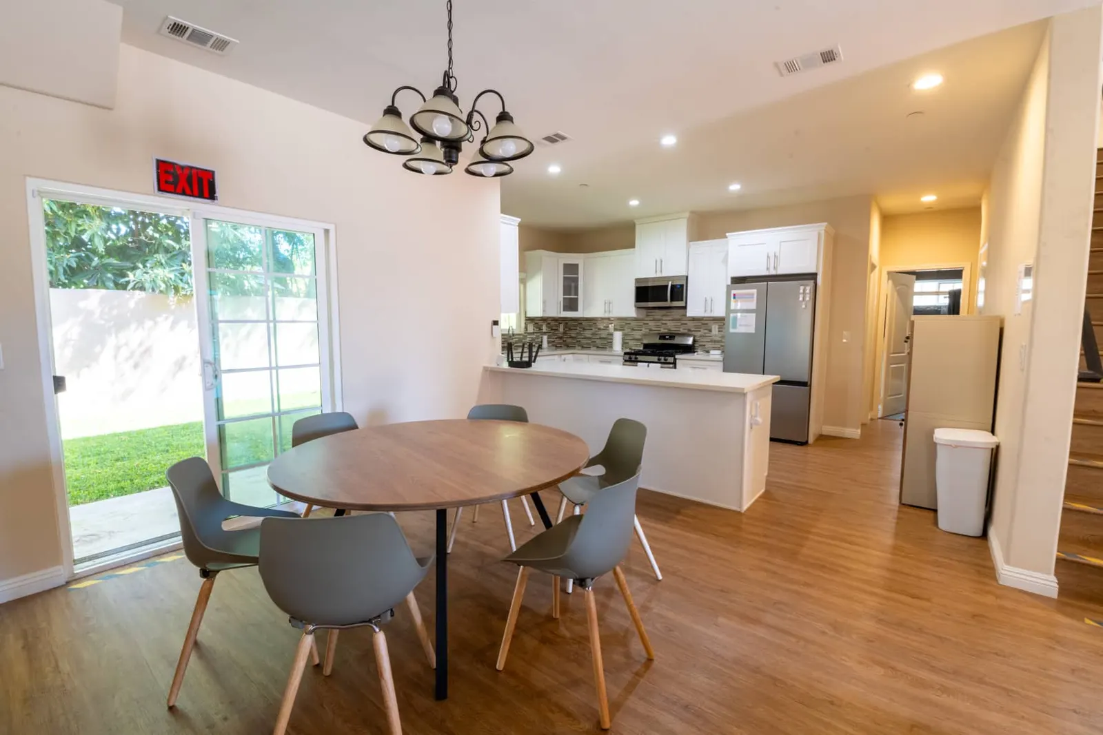 Open dining area and fully equipped kitchen with stainless appliances