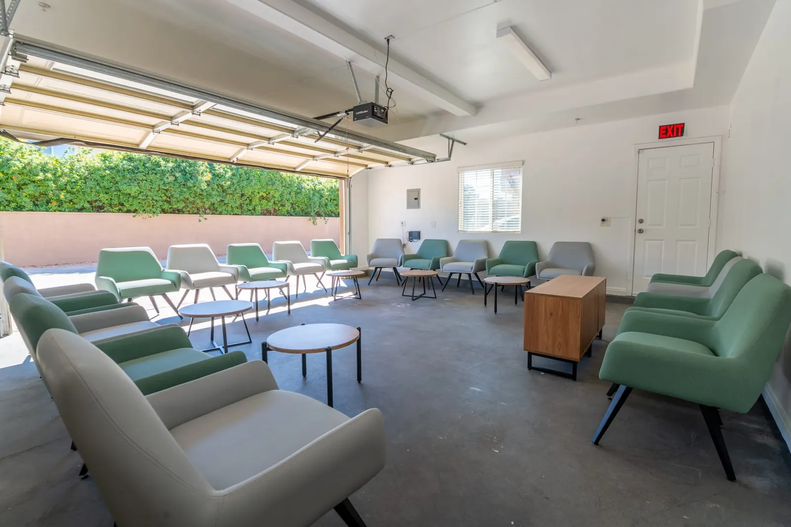 Group therapy room set with armchairs arranged in a circle